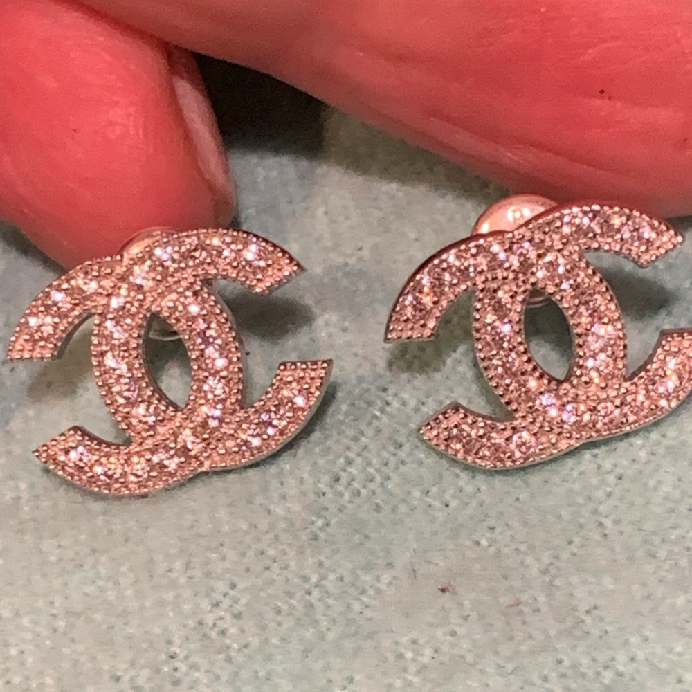 Absolutely stunning CC silver brand new  studs earrings with sparkly crystals .